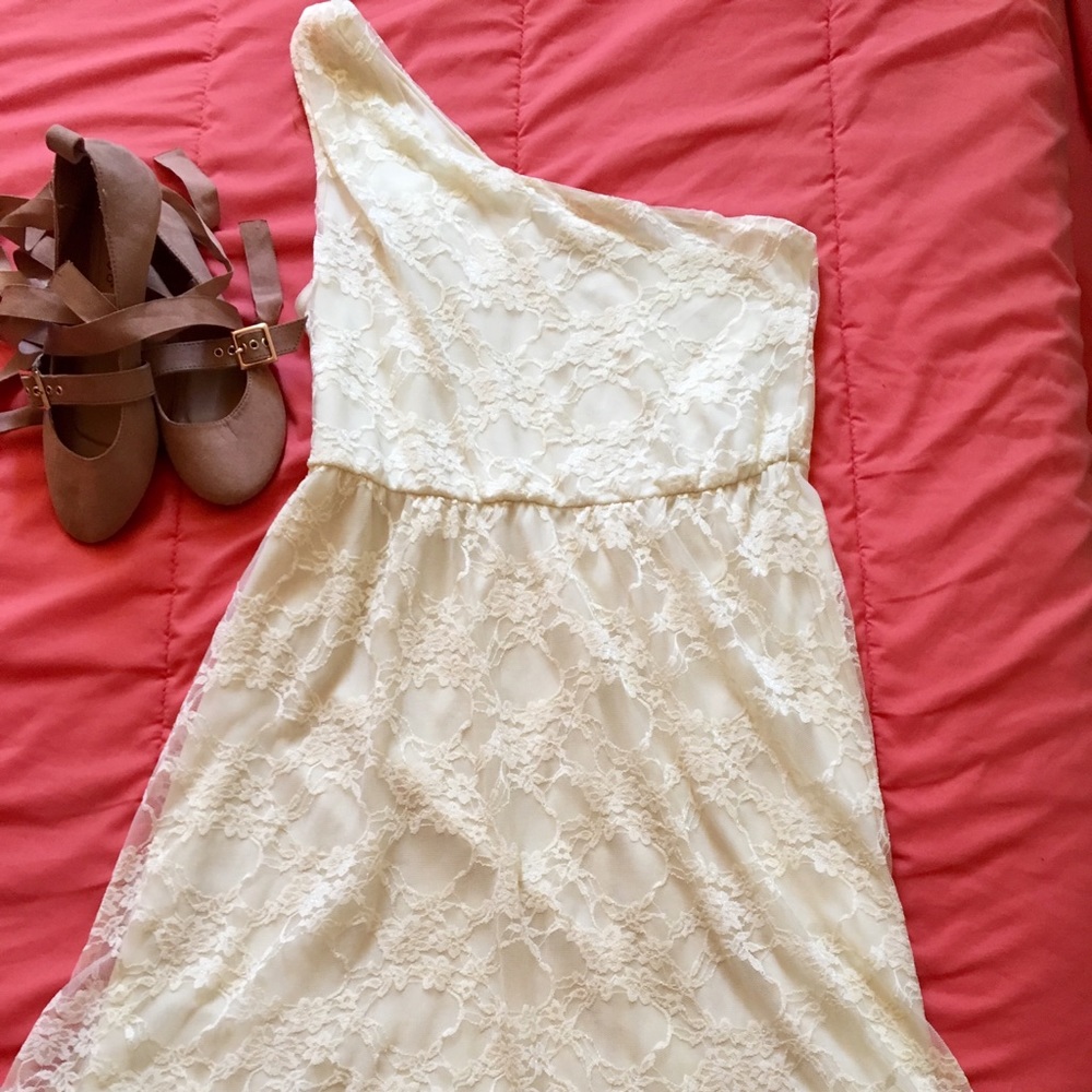 Cream shoulder fit and flare dress. Toga style